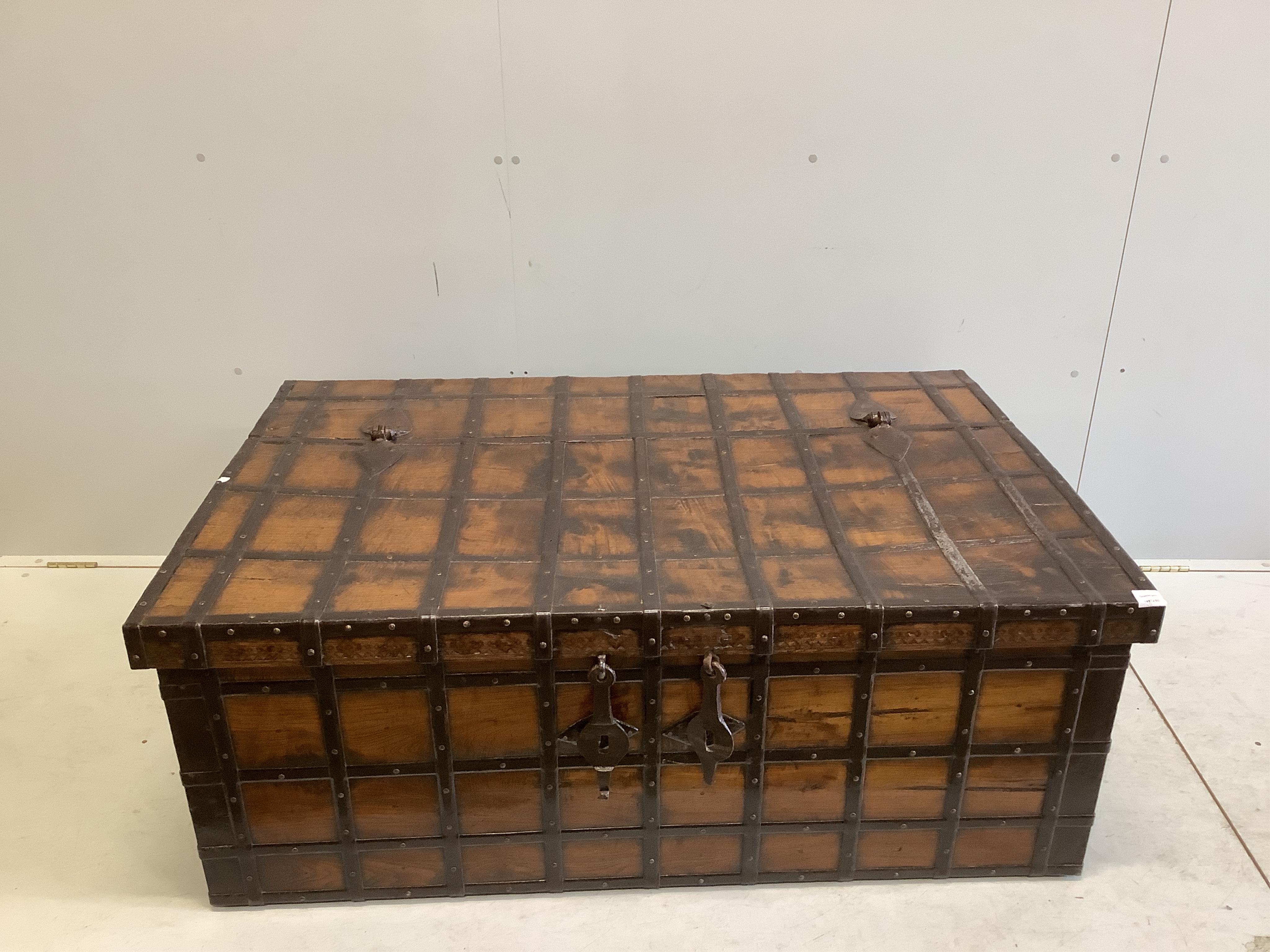 A Spanish wrought iron bound chestnut chest, width 134cm, depth 86cm, height 52cm. Condition - fair to good